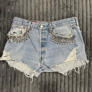 [SOLD] Levi's 501 studded, distressed denim shorts with frayed hem.